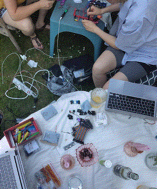 two members of actinomy sitting in a garden and working on their micro servers